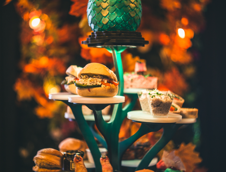 Themed afternoon teas London: a stand designed like a tree, with individual shelves holding different food items.
